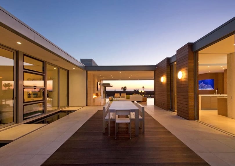 EYRC Architects Irvine Cove Residence interior courtyard night